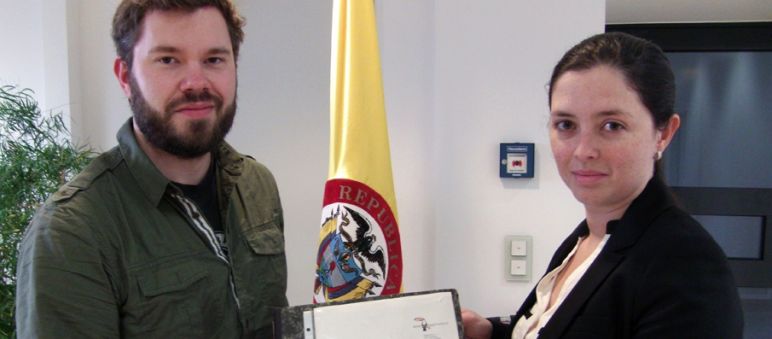 Handover of the signatures in the Colombian embassy David Vollrath from Rainforest Rescue hands over the signatures to the diplomatic secretary