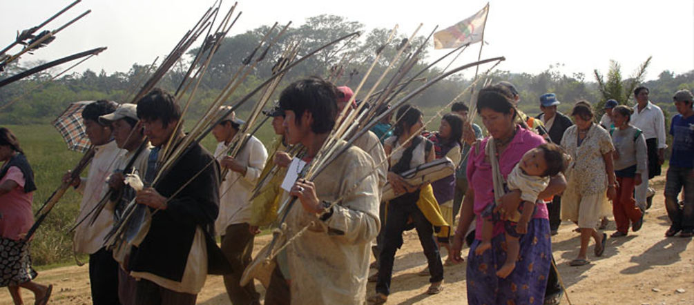 Bolivian Indians on their way to la Paz Bolivian Indians walking their protest march with arrow and bow in their hands