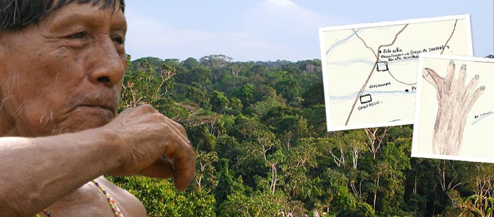 Indigenous man in front of rainforest