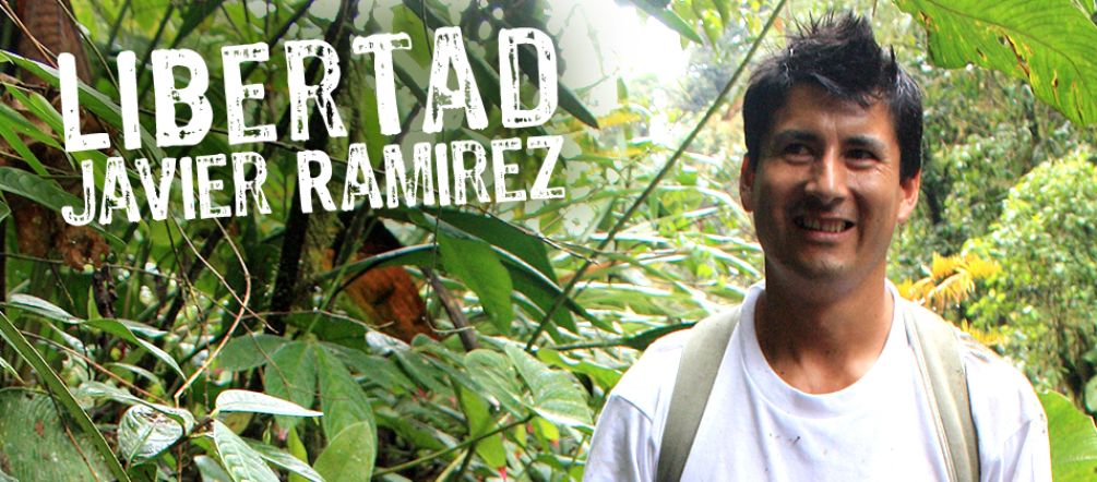 Jailed community leader Javier Ramírez is fighting to preserve the Intag cloud forest. Javier Ramírez standing in front of rainforest plants
