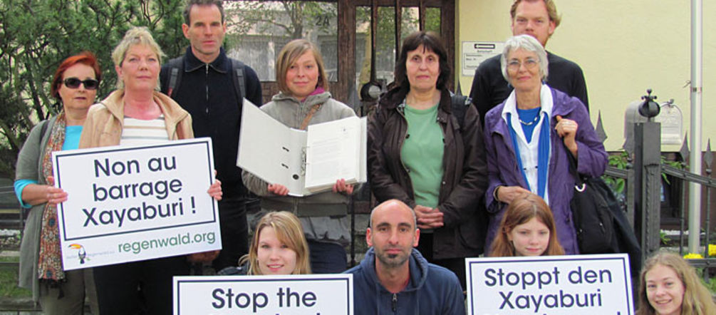 At the Laos embassy in Berlin People infront of the embassy in Berlin holding protest signs against the dam