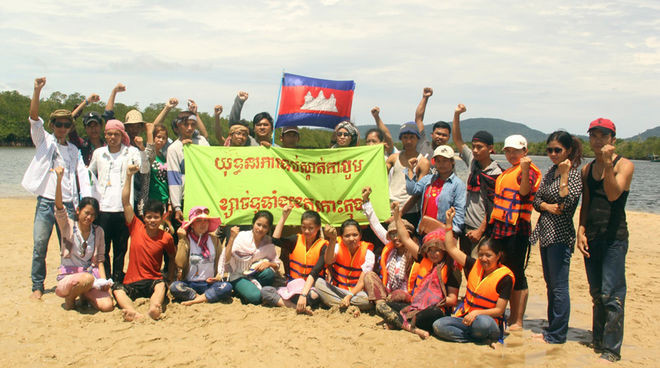 Mother Nature activists with a banner reading “Stop dredging in Koh Kong province” sand demonstration