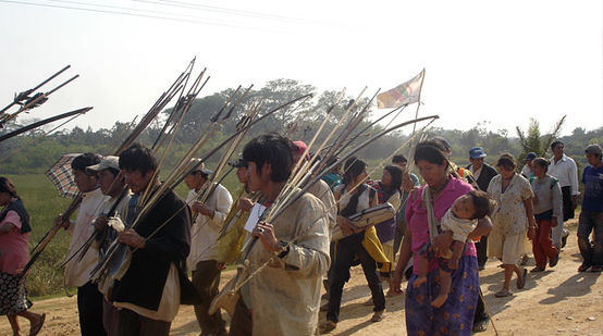 Bolivian Indians walking their protest march with arrow and bow in their hands