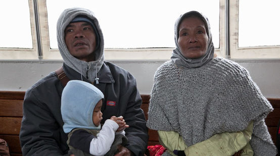 A family with child: Bidin, Ida and son Agung