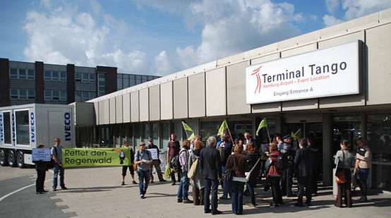 Protesters standing infront of "Terminal Tango" at Hamburg Airport