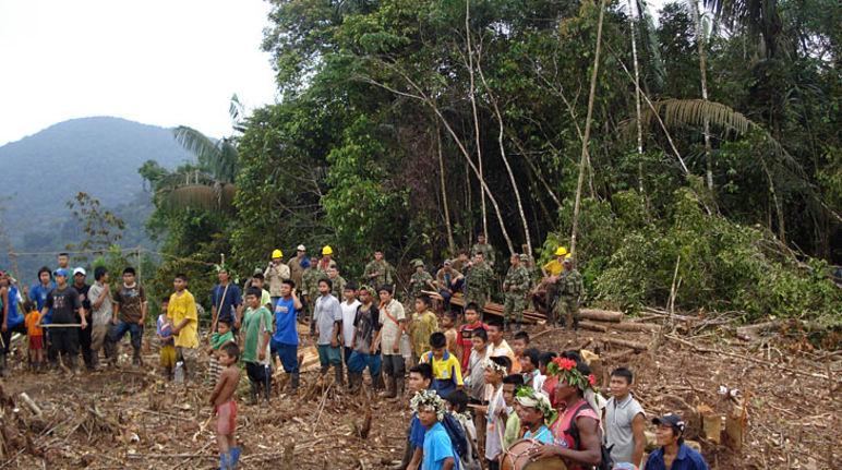 A community of the indigenous tribe embera standing in a clearing