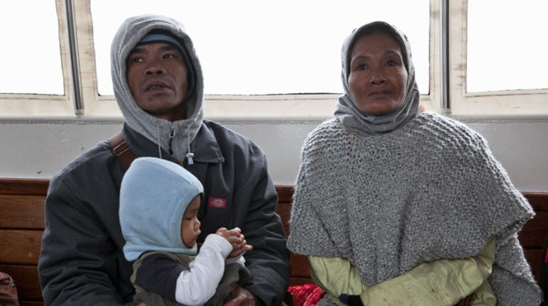 Bidin, Ida and their son Agung A family with child: Bidin, Ida and son Agung