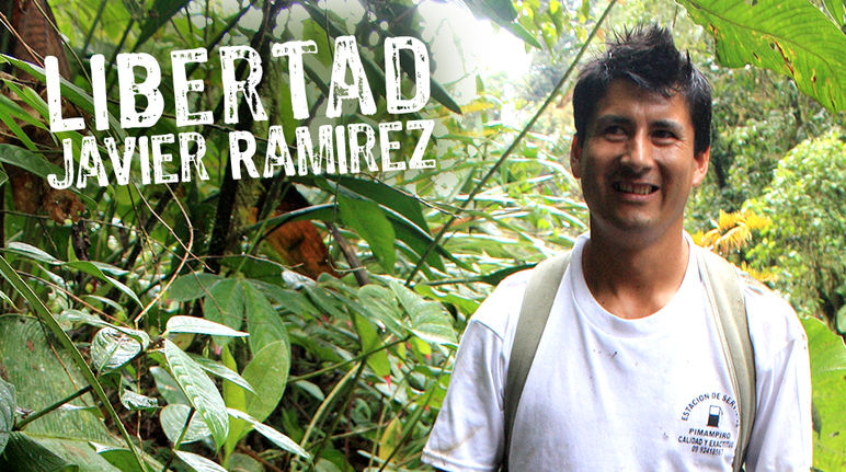 Jailed community leader Javier Ramírez is fighting to preserve the Intag cloud forest. Javier Ramírez standing in front of rainforest plants
