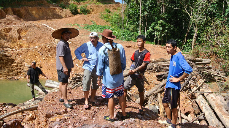 Activists that fight for the rights of indigenous people live in constant danger Matek (SADIA) with indigenous people at an illegal logging site