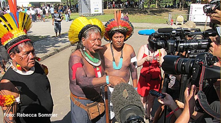 Chief Raoni with his feathered headdress and war paint gives an Interview