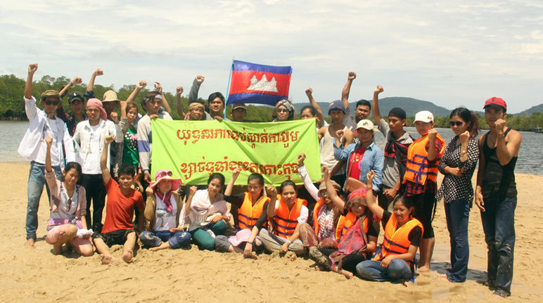 Mother Nature activists with a banner reading “Stop dredging in Koh Kong province” sand demonstration