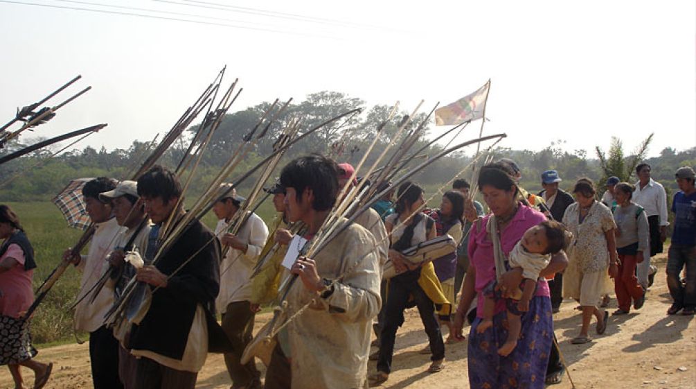 Bolivian Indians on their way to la Paz Bolivian Indians walking their protest march with arrow and bow in their hands