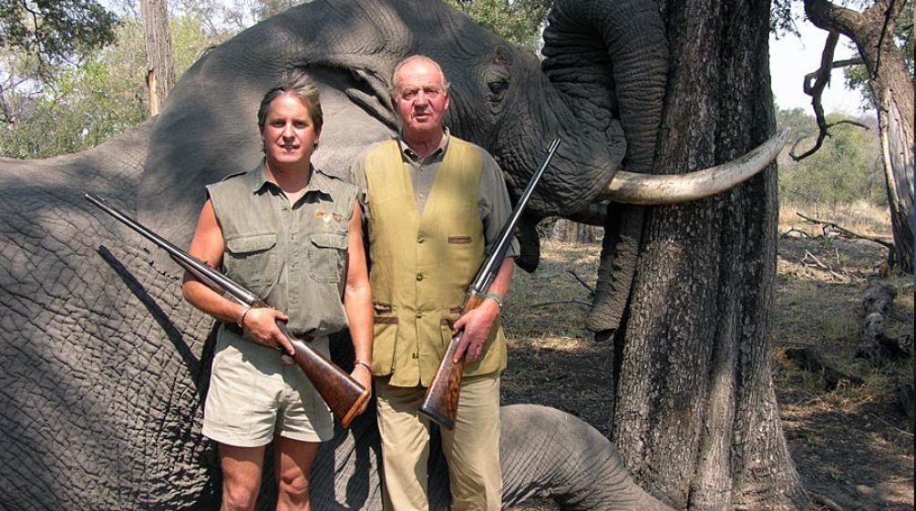 Spain’s head of state Juan Carlos in front of his prey, a shot elephant