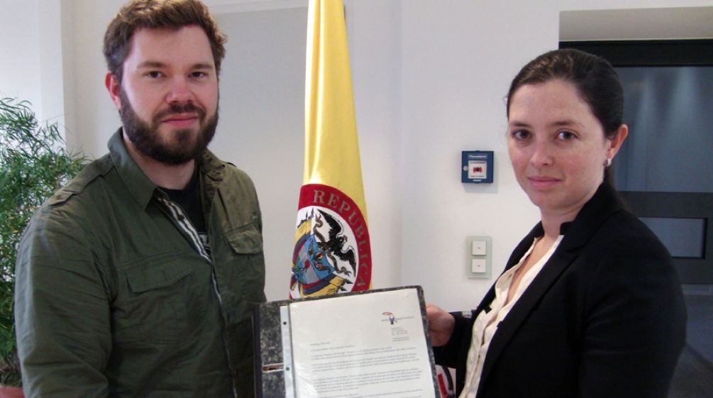 Handover of the signatures in the Colombian embassy David Vollrath from Rainforest Rescue hands over the signatures to the diplomatic secretary